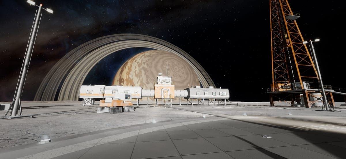A research station and drilling tower on Elah's ice, Goliath and its ring huge in the black sky.
